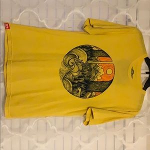 Yellow graphic tee.